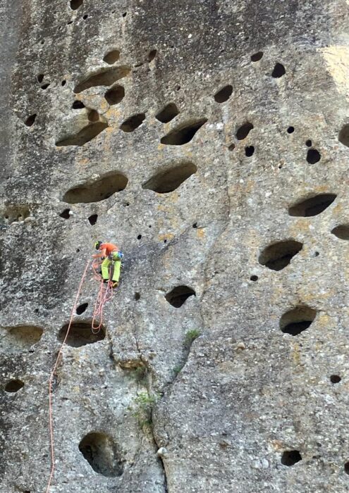 Climbing on natural holes in Meteora.