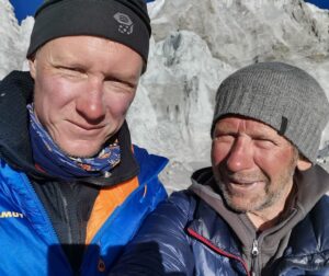 Close shot of the climbers at Base Camp with sun-burnt faces