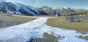 little snow on a green plain at Ax 3 Domaines' ski resort.