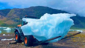 piece of iceberg lifted by forklift