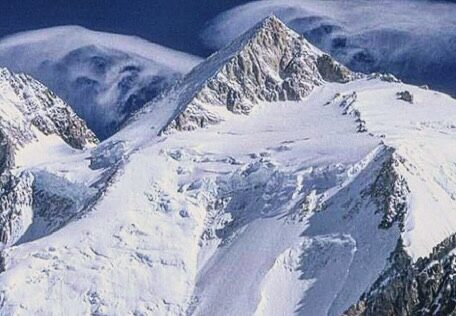Gasherbrum II with wind clouds over its pyramidal summit.