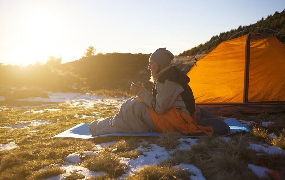 girl sitting in a sleeping bag