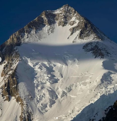 Gasherbrum I, aka Hidden Peak, showing the rocky summit sections on top of a central glacier. Photo: Sirbaz Khan