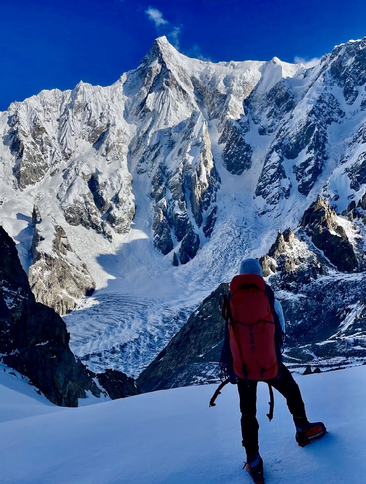 Ethan Berman in front of the Southeast Pillar of Ultar Sar, on their approach from Base Camp. 