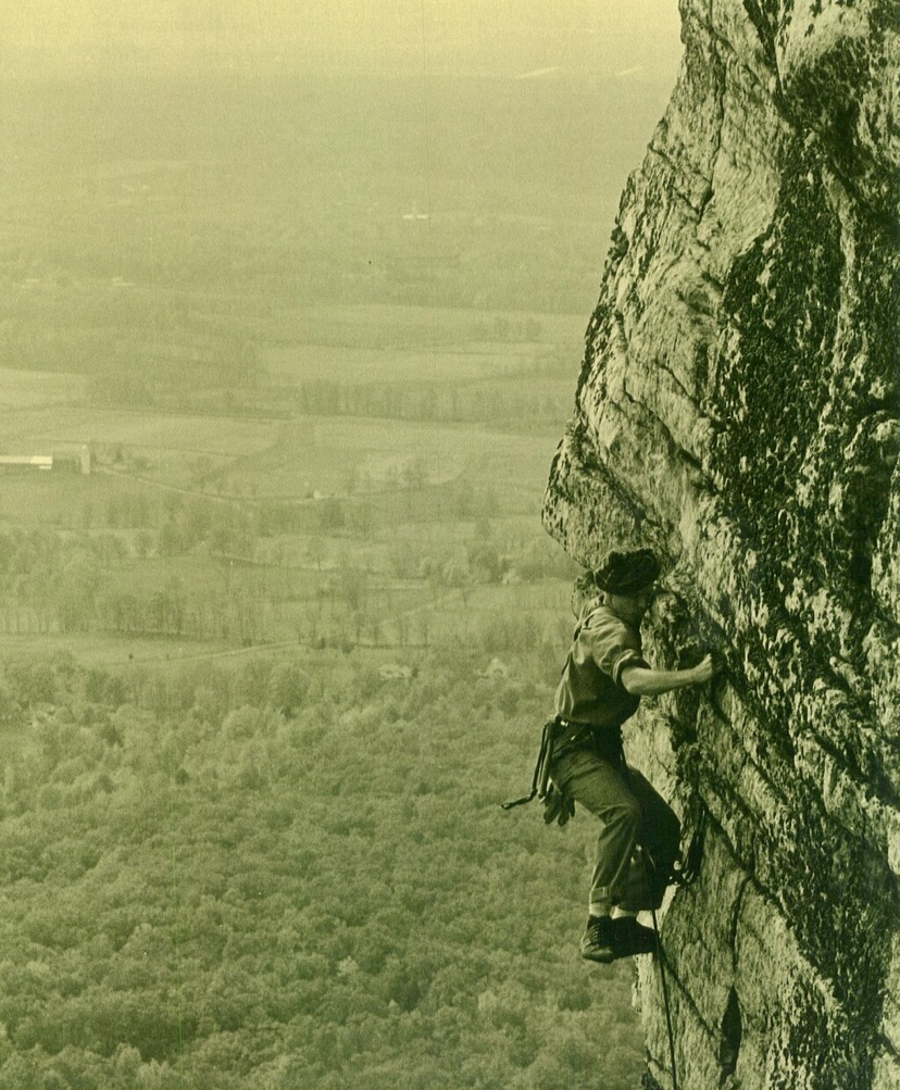 Johnny Waterman's father, Guy Waterman, climbing on a cliff. 
