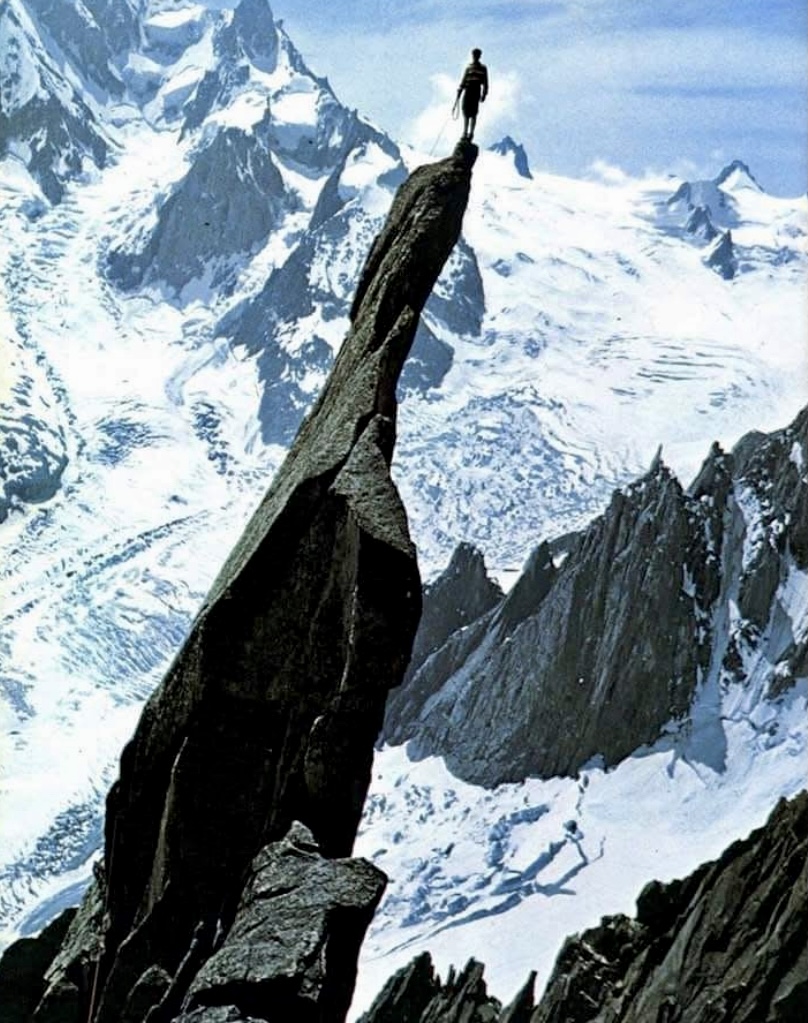 Gaston Rebuffat on the arrow of the Pic du Roc in the Alps. 