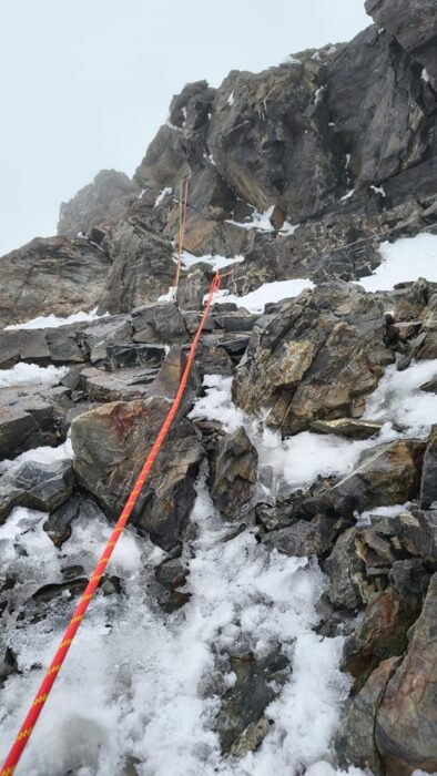 A red rope on a rocky section of K2.