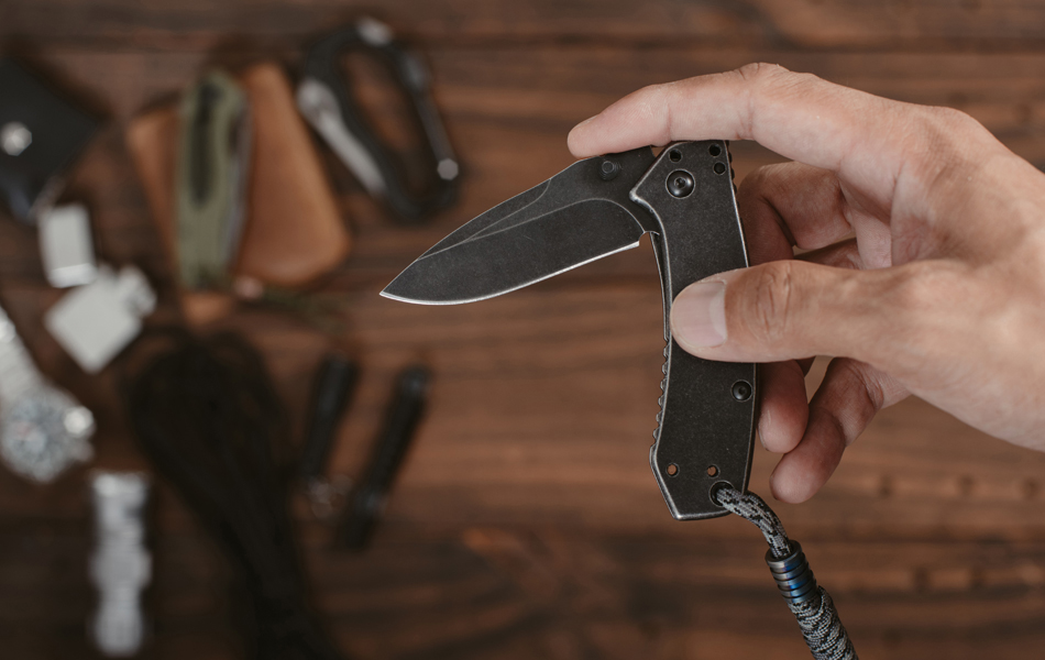 man holding camping knife