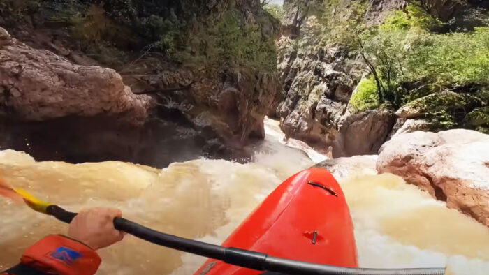 a POV of a kayaker running rapids