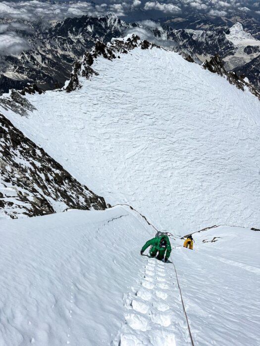 Climbers on a snow ramp up the Rupal face of Nanga Parbat. 