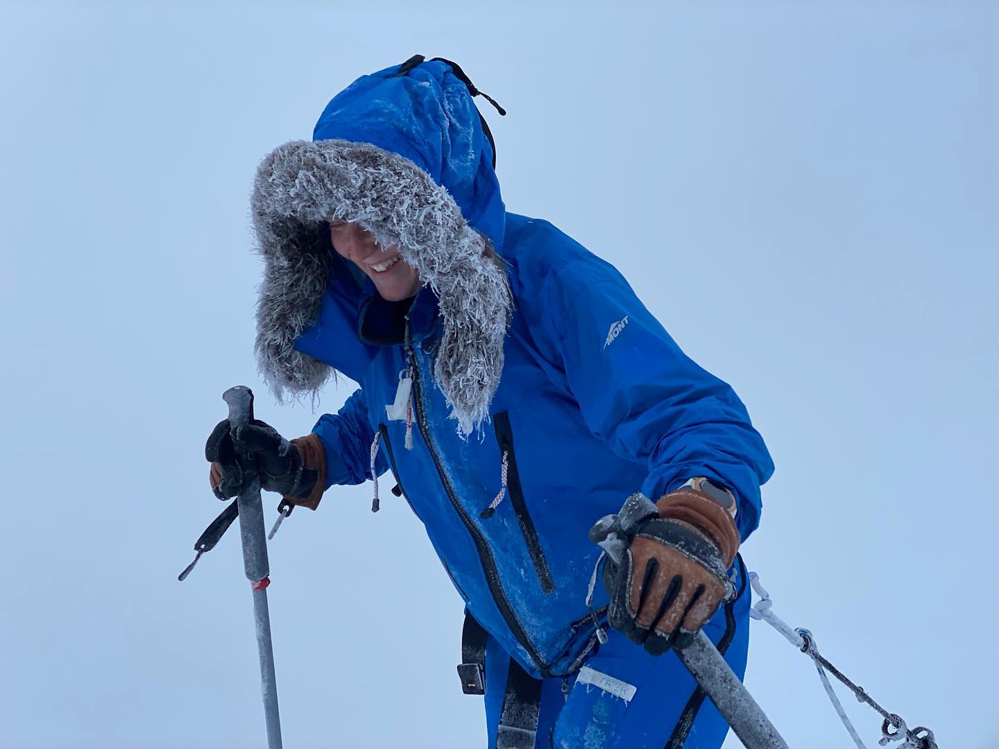 half-body shot of skier in blue parka