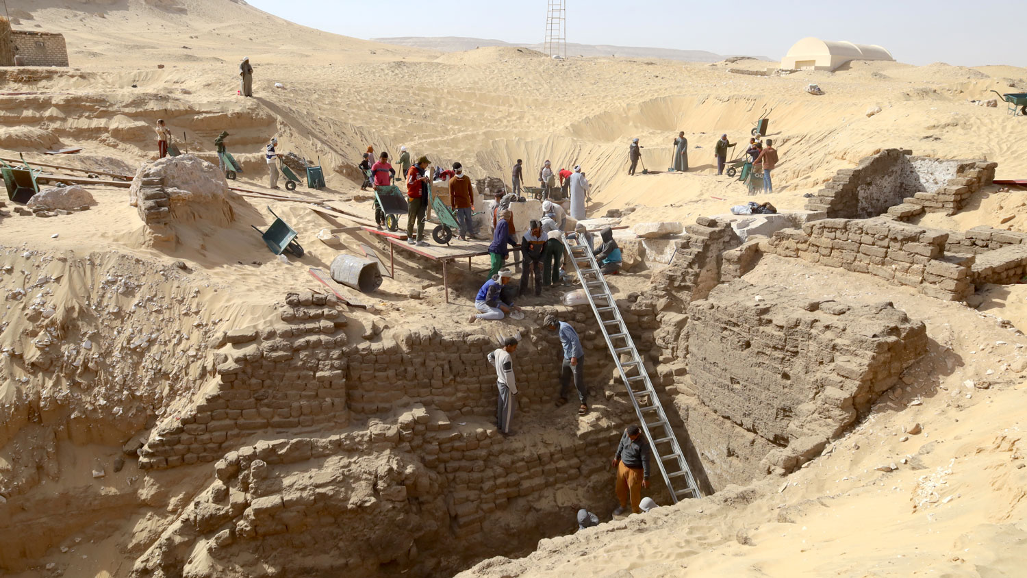 Dozens of people working on a dig site in Egypt