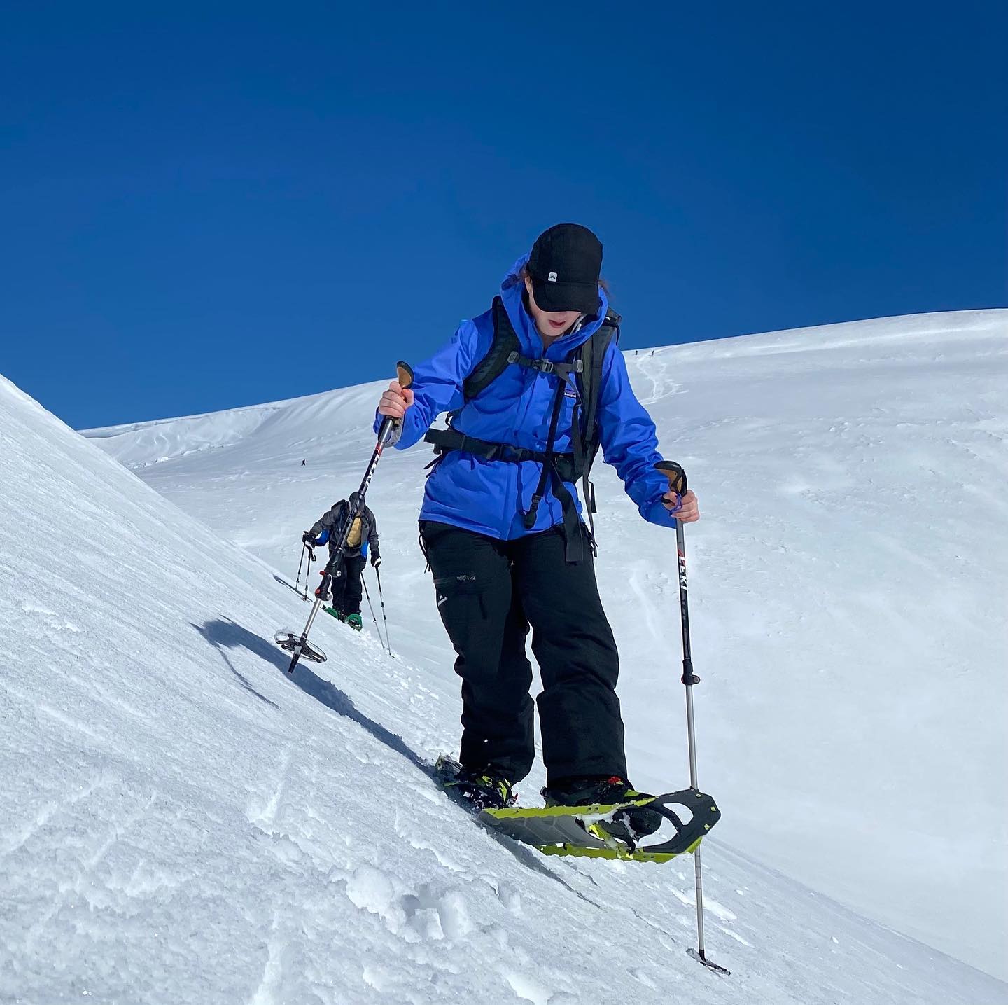 snowshoer in blue parka