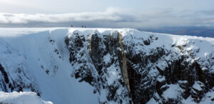 Climbers on a snowy ridge.