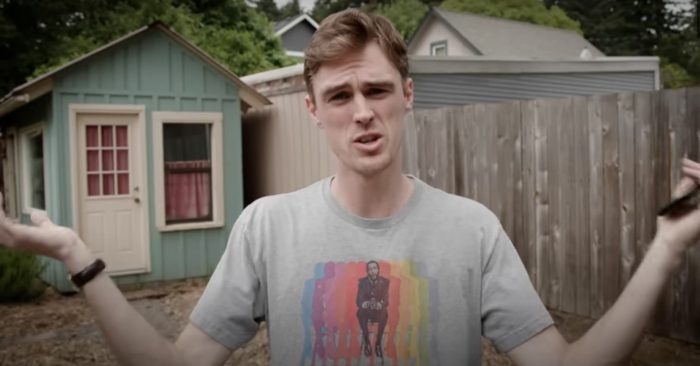 a man looks into the camera with a puzzled expression