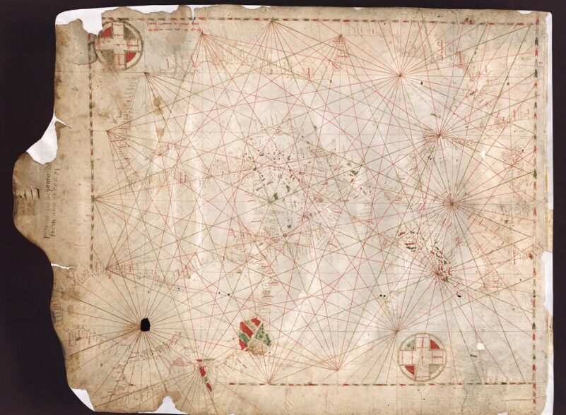 An aged map of the Black Sea region, covered in crisscrossing red rhumb lines.