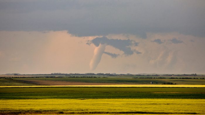 a tornado forms over the prairie in Saskatchewan.
