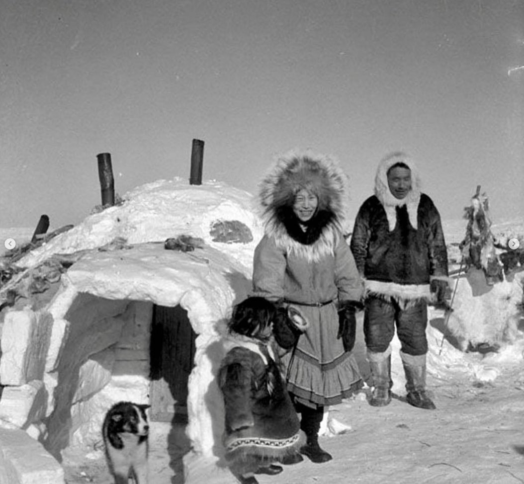 A family wearing traditional fur ruffs.