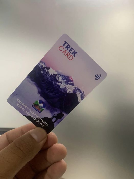 A Trek Card in someone's hand
