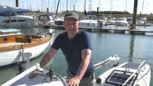 a man aboard a row boat